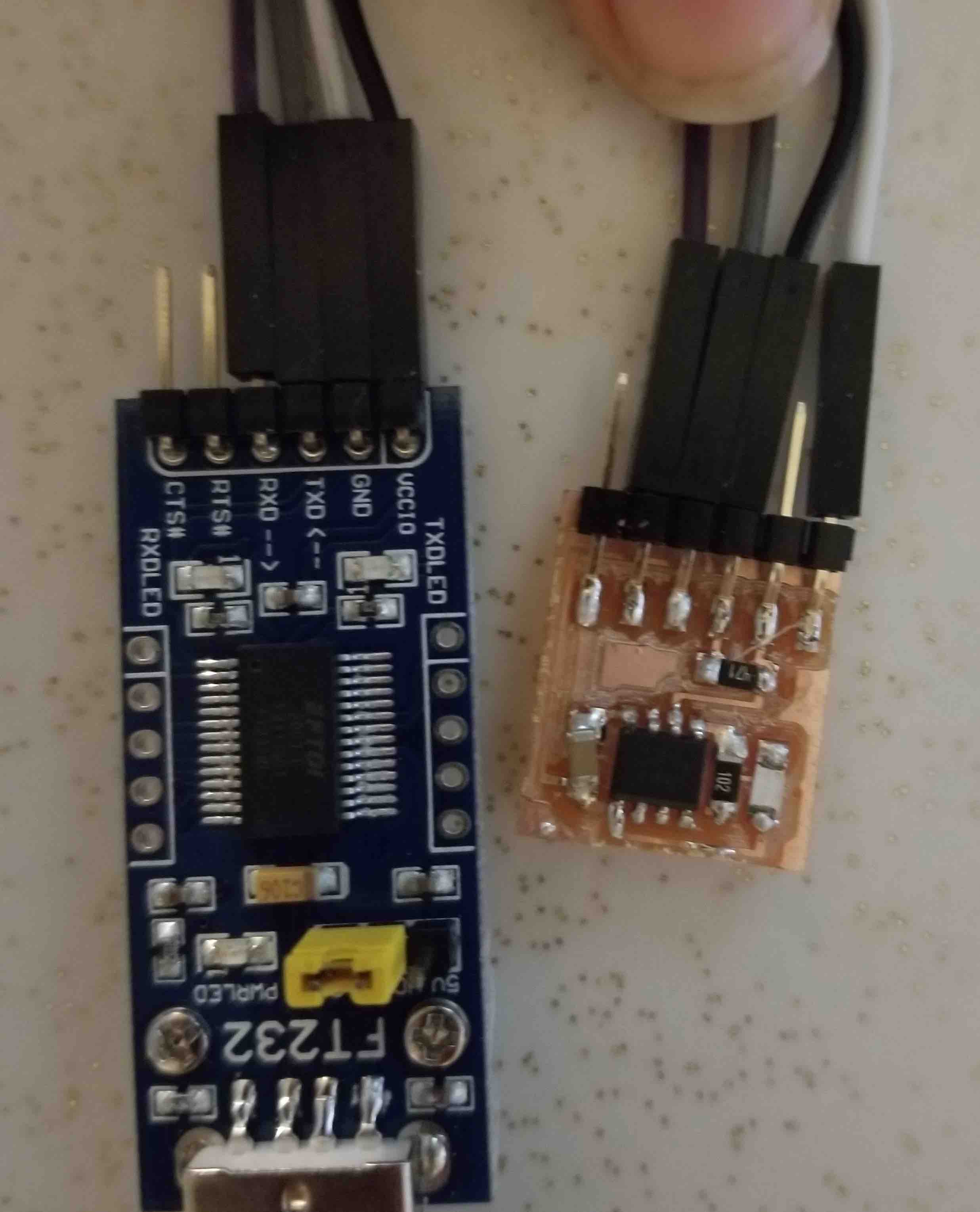 My ATtiny412 board with a lit up LED.